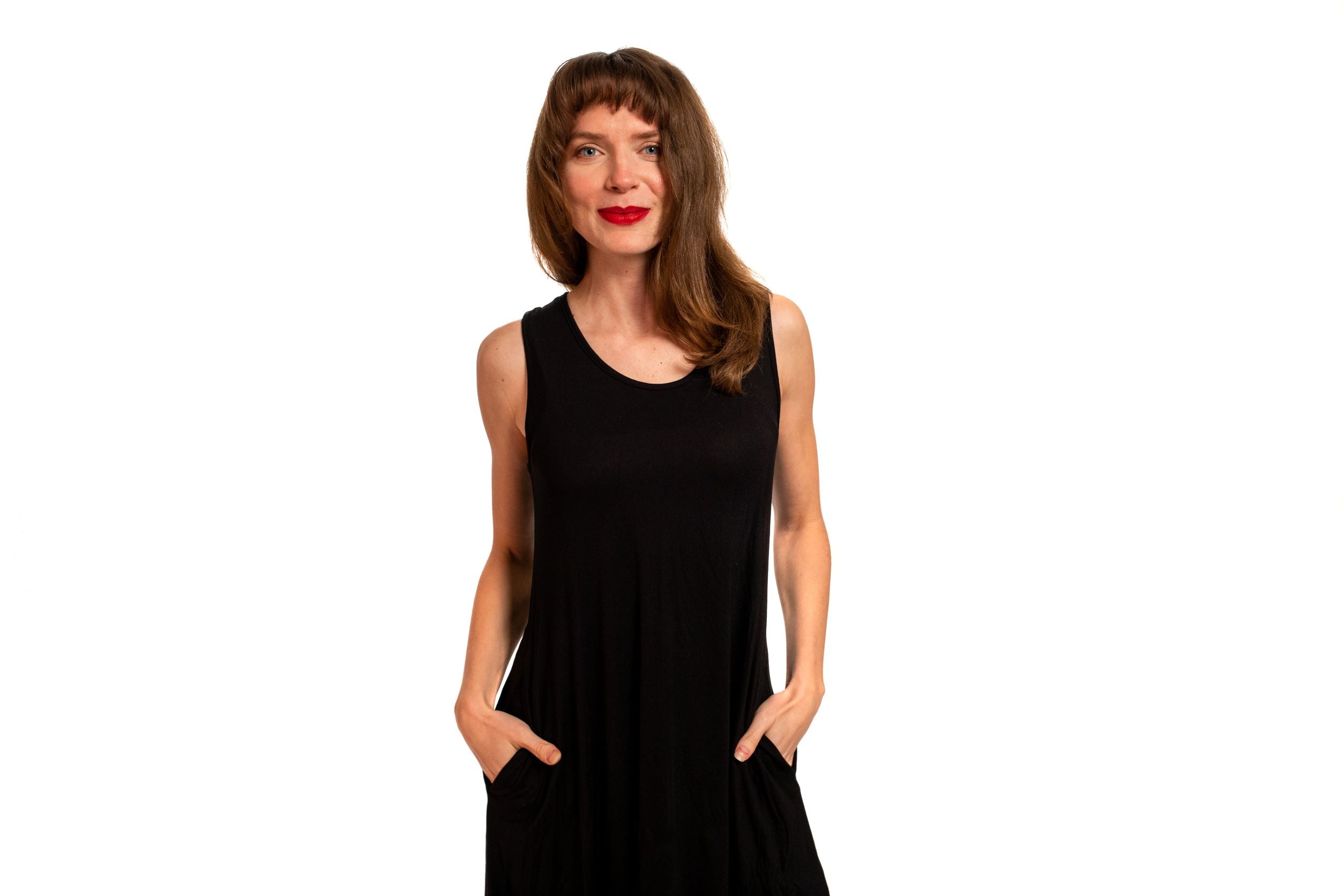 Women's A-line dress 2" above the knee sleeveless and side pockets.
